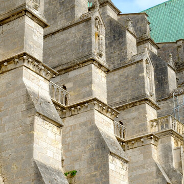 Stone tower and flying buttresses on a Gothic cathedral