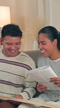 Joyful millennial husband and wife celebrating success with a high five gesture after finishing flat pack furniture assembly together in a bright, cozy living room interior