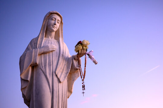 Statue of the Blessed Virgin Mary at sunset on Mount Podbrdo, the Apparition Hill overlooking the village of Medjugorje, Bosnia and Herzegovina.