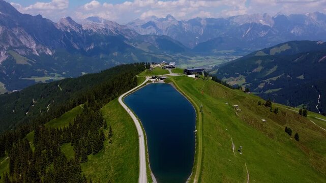 Aerial View of a Mountain Lake Surrounded by the Austrian Alps near Leogang