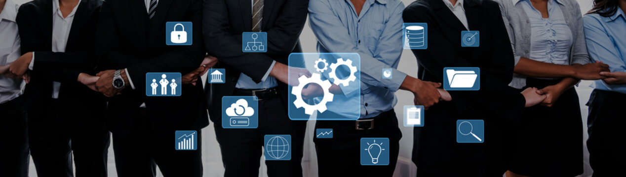 This image shows a diverse group of business professionals standing together, with digital icons symbolizing teamwork, technology, and analysis, emphasizing collaboration and innovation. Trope