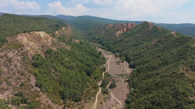 Aerial view of the Stob Pyramids gorge and dirt trail, Bulgaria
