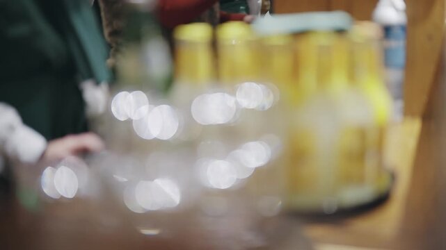 Warm blurred background view of cozy Christmas market bar stall party scene in Berlin, Germany
