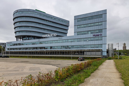 Zwolle, Netherlands. 23 August 2026. Exterior view of the modern Wehkamp office building featuring curved architecture, with PwC and Wijzer logos also visible.