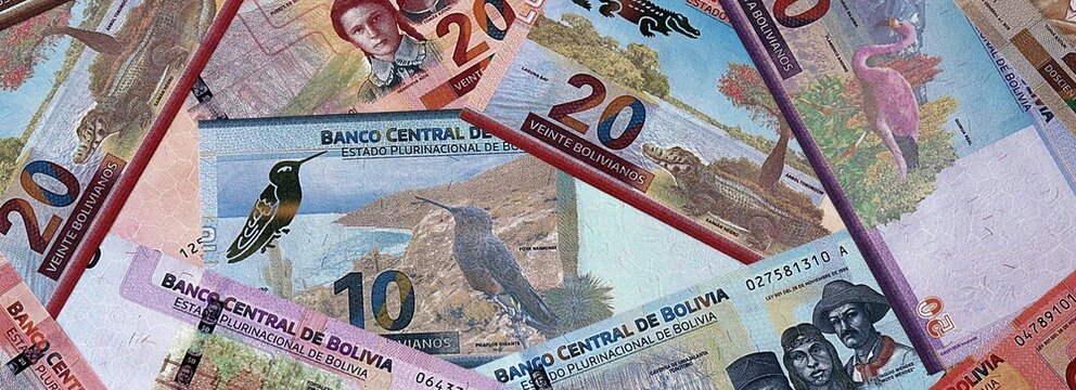 Bolivian boliviano money bills in pile. Big amount of Bolivia BOB currency cash close up
