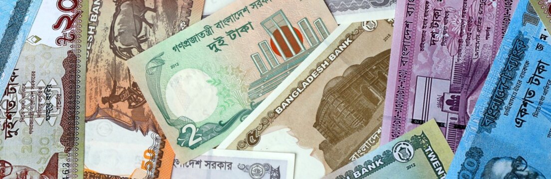 Bangladeshi taka money bills in pile. Big amount of Bangladesh BDT currency cash close up