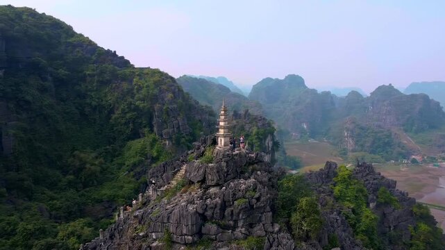 Aerial View of Hang Mua Pagoda Peak in Ninh Binh Vietnam: Majestic Limestone Karsts & Valley 4K Drone Footage