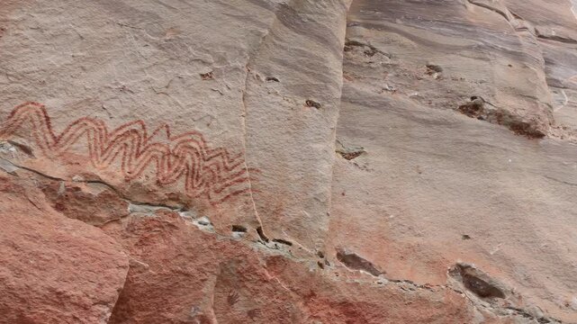 Ancient prehistoric cliff rock painting at Pha Taem National Park, Ubon Ratchathani, Thailand.