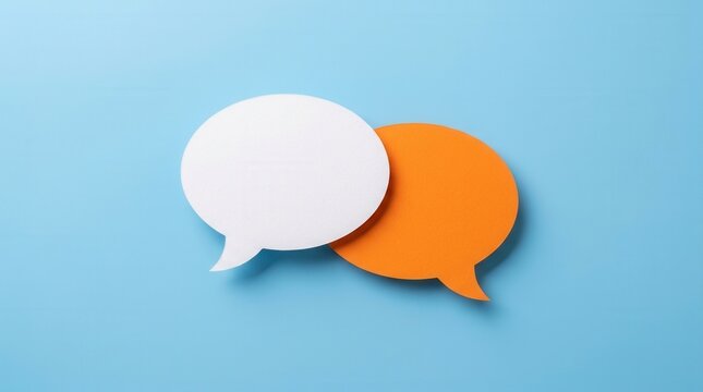 White and orange color paper speech bubbles on blue background for design, flat lay top view communication template.