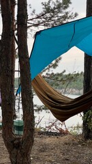 Cozy camping setup by the lake at sunset with outdoor meal © Катя Скрипник