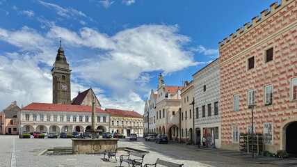 Obraz premium The Peace Square with its church and fountain in the old town of Slavonice in Czechia