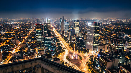 Obraz premium Mexico City skyline aerial night view with illuminated avenue and traffic light trails
