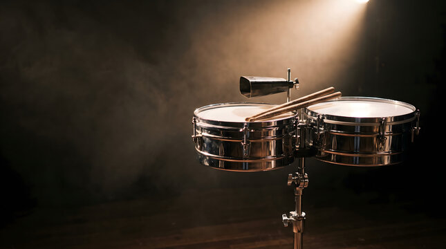 Timbales drums set with sticks and cowbell on stage