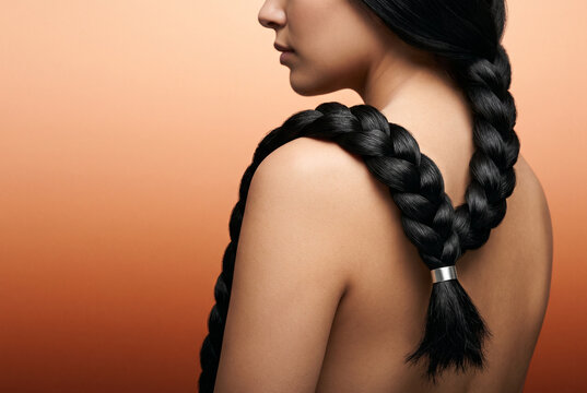 Braided Hair Portrait of a Woman on a Soft Gradient Background