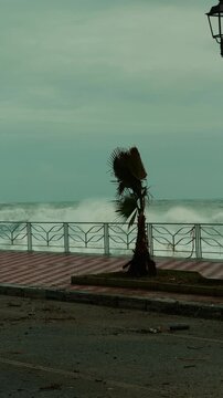 Ocean waves crash onto the shoreline during a major storm surge