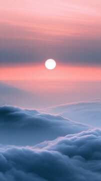 Serene sunrise over soft rolling clouds blending pink and blue hues creating a peaceful and dreamy morning sky landscape scene