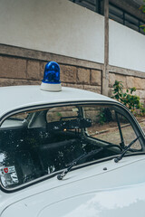 Caramulo, Viseu, Portugal – September 04, 2026: Vintage Portuguese police car with a blue siren at the Caramulo Motorfestival. © Marco