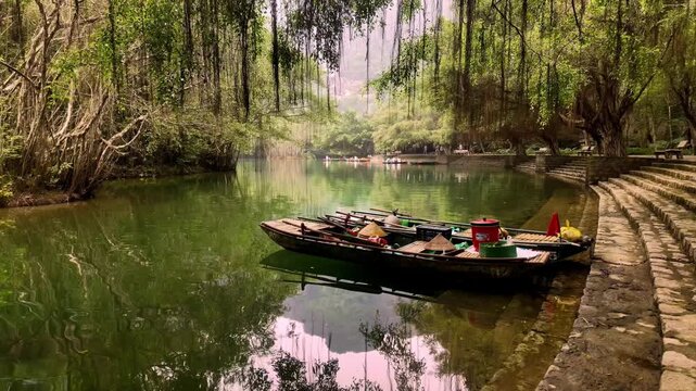 Moored Wooden Boats with Conical Hats along Stone Steps at Trang An River Dock in Ninh Binh Vietnam - Stabilized Gimbal Shot Color Graded B-Roll
