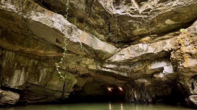 Exploring Mysterious Trang An Water Cave with Ancient Limestone Ceiling in Ninh Binh Vietnam - Stabilized Gimbal Shot Color Graded B-Roll