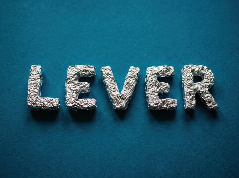 Silver foil leverage letters on teal background for business strategy