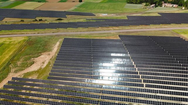 Aerial view of solar farms beside a country road in Avila Spain