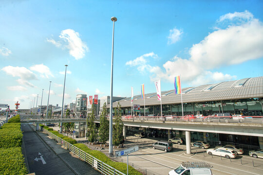 Hamburg GE, August 20, 2023: Gardening at Airport of Hamburg  and Radisson ay background with rainbow flags
