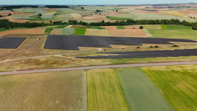 Photovoltaic fields spanning cropland in Avila Spain