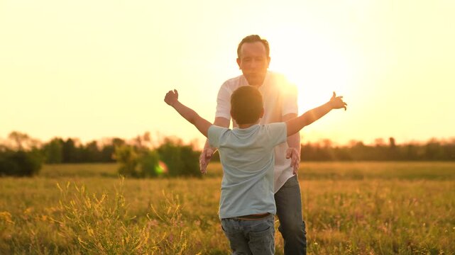 happy family, childhood dream flying, kid with male parent nature, little boy playing with his dad sunset, father playing with child at sunset, father and child interest at sunset, father enjoying