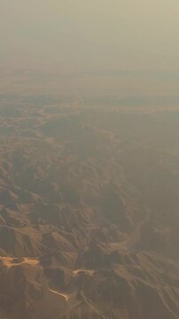 Vast desert landscape at dawn with hazy sky and rolling hills.Egypt. 