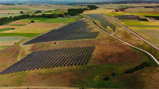 Drone view of solar farms and patchwork fields in Avila