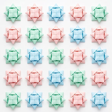 Joyful colorful paper bows arranged in festive pattern