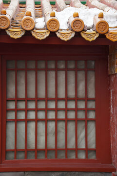Traditional Chinese Roof Ornamentation with Snow