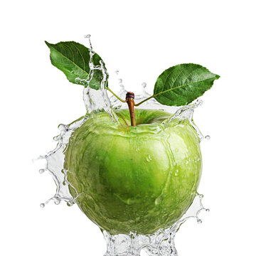 Fresh green apple with two leaves surrounded by dynamic water splashes and droplets on a clean white surface isolated on a transparent background