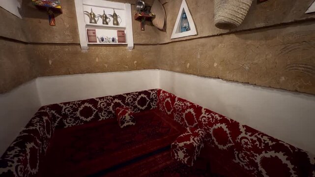 Traditional Saudi Heritage Room Interior with Clay Mud Walls and Majlis Seating