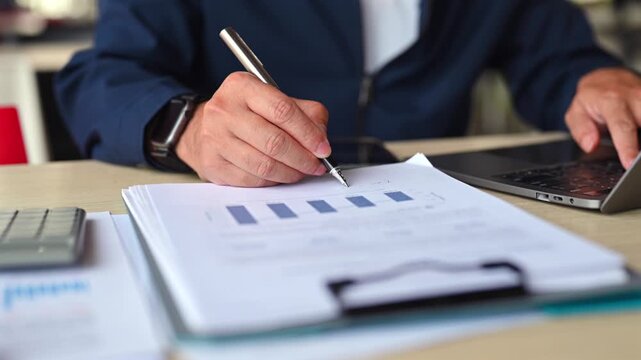 Businessmen perform detailed financial analysis regarding investment opportunities, reviewing chart analysis attached in document format when executing strategic investment decisions prior data.