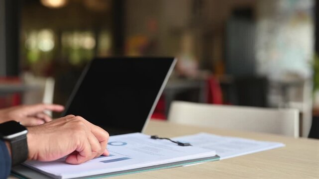Corporate analysts conduct market research inside offices, performing data analysis regarding investment research, executing report analysis before completing strategic business research.