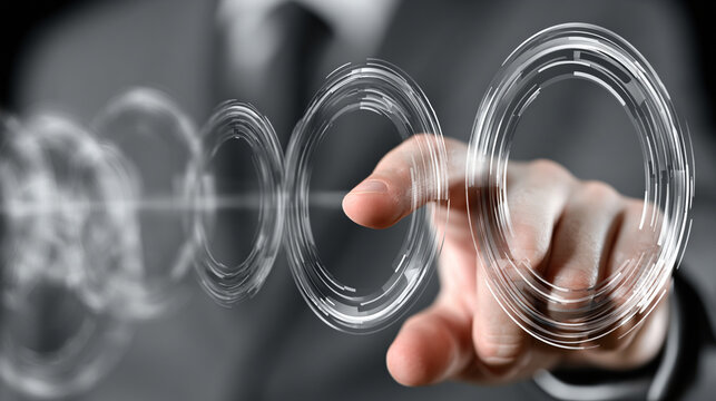 Hand touching futuristic transparent concentric glass rings interface with blurry background suit
