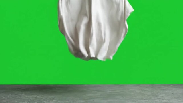 Little white sheet ghost jumping on green screen for halloween