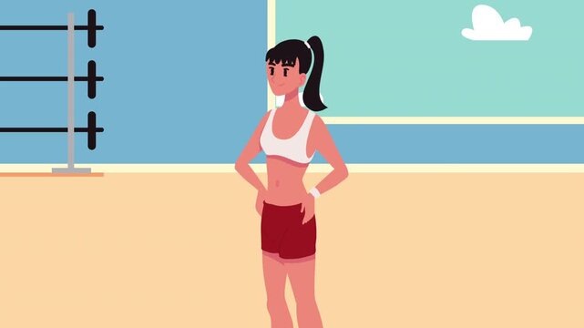 Fit woman in sportswear standing in gym with exercise equipment in background.