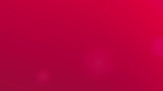 Abstract gradient background with soft pink and red blurred tones