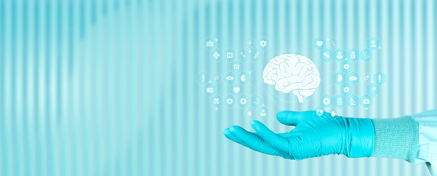Educational concept about dementia, Alzheimer's, and cognitive decline. A doctor's hand displays a brain icon on a digital screen against an emerald green background.