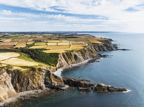 Cliffs and Fields over Welcombe Mouth Beach from a drone, North Devon and Cornwall Coastpath Border, Devon, England, Summer 2026
