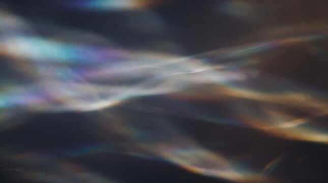 Prism light leak texture on dark background, rainbow lens flare overlay, ethereal caustic light refraction effect