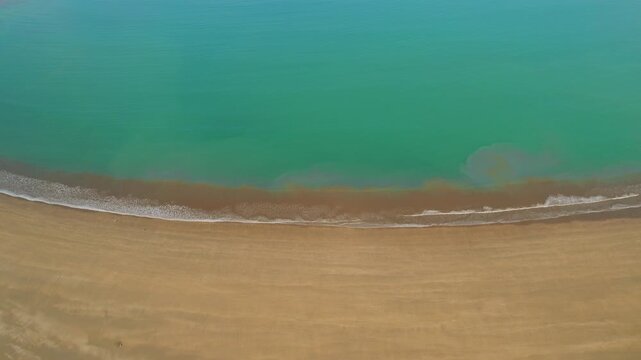 Blue ocean water meets sandy shore at Marino Ballena National Park Costa Rica