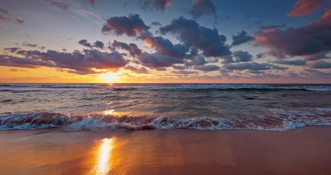 Scenic summer sunrise over sea and tropical beach shore