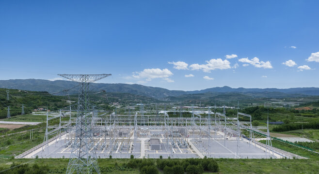 Aerial View of High Voltage Substation with Energy Storage Stations in Valley