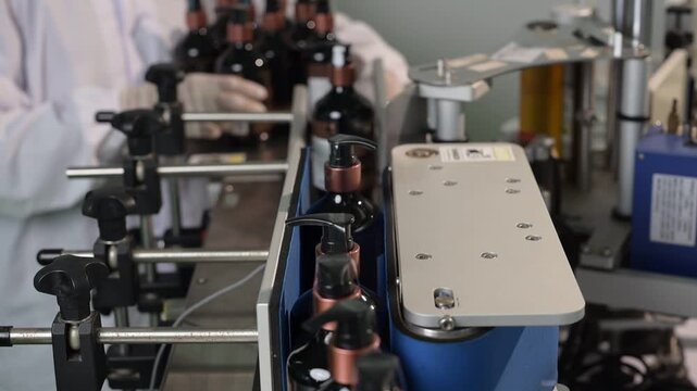 Automated production line bottle dispenser labeling machine factory industrial manufacturing worker assembly packaging technology efficiency, bottling automation factory production label machine