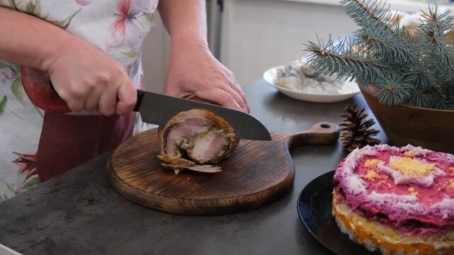 Baked pork belly. The cutting process. Preparing for the holiday. Christmas.