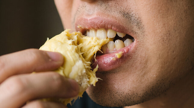 Close up of a person taking a bite of a delicious savory wrap