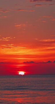 Cinematic orange sunrise over the ocean waves